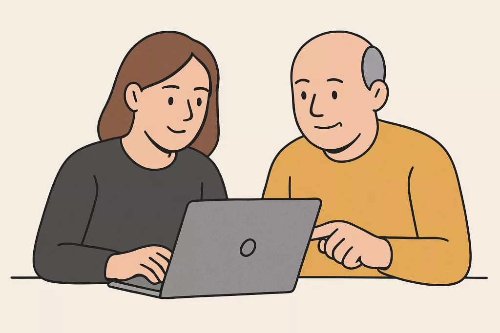 A man and woman working and collaborating at a laptop
